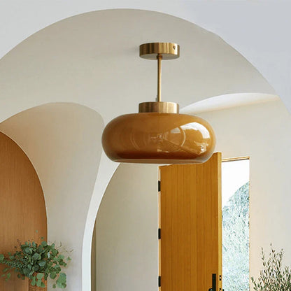 Elegant loftlampe med orange glasskærm i vintage stil