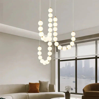Moderne LED-pendellampe med lysende kuler – halskæde-design