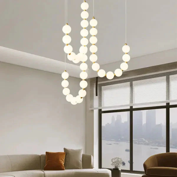 Moderne LED-pendellampe med lysende kuler – halskæde-design