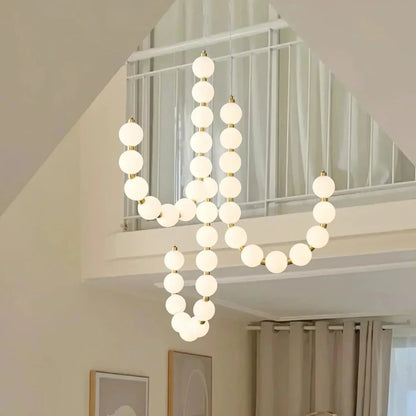 Moderne LED-pendellampe med lysende kuler – halskæde-design